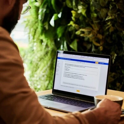 Man using Microsoft Word on Laptop